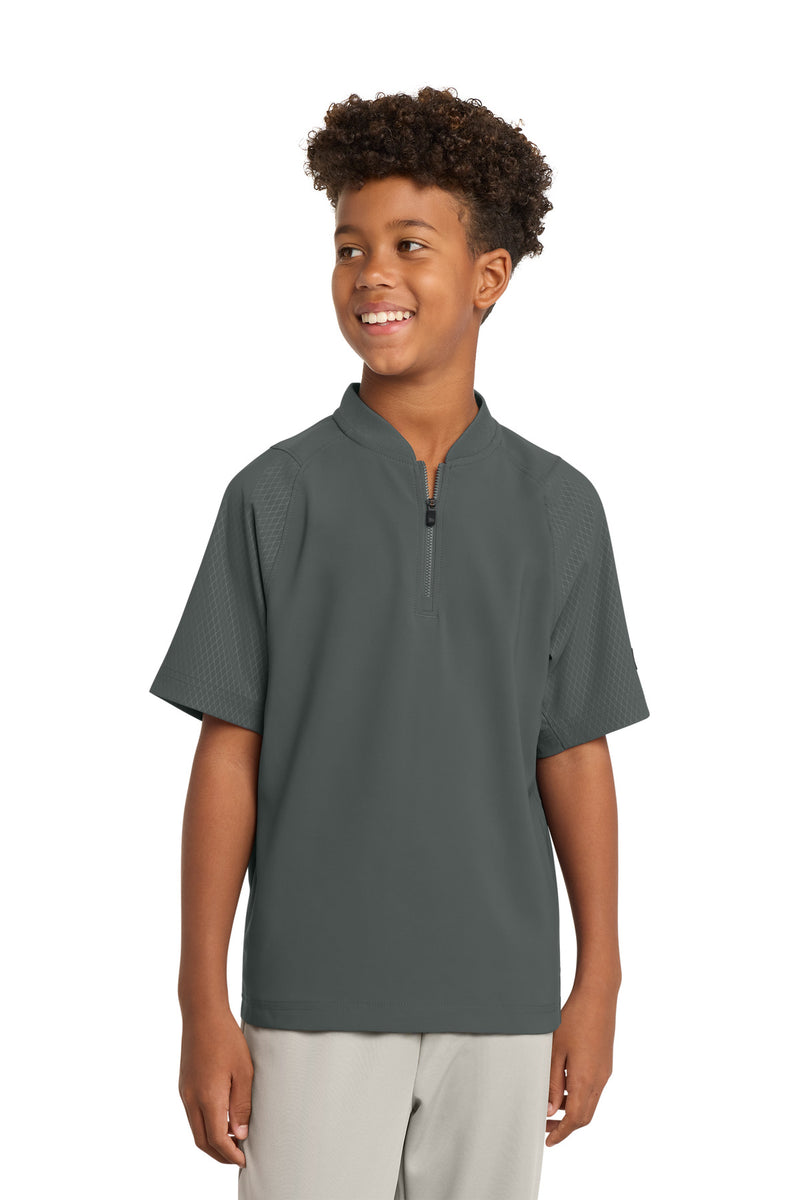 New Era  ®  Youth Cage Short Sleeve 1/4-Zip Jacket. YNEA600